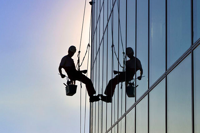 Facade Glass Window Cleaning using Rope Access Technique